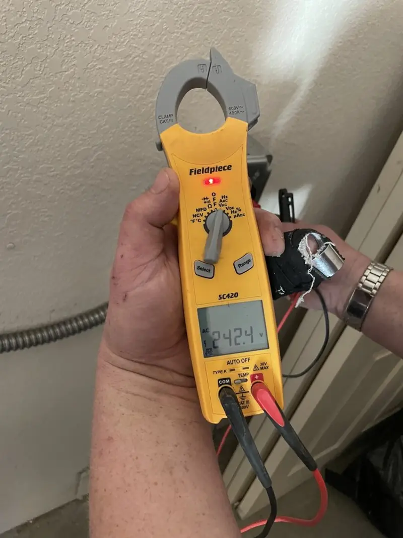 Voltage testing with clamp meter during Generator Installation in Wayne